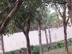 Indian couple kissing in park 1