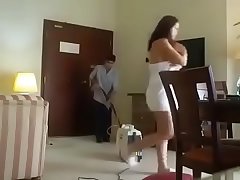 Desi indian asian girl in towel in front of cleaner boy